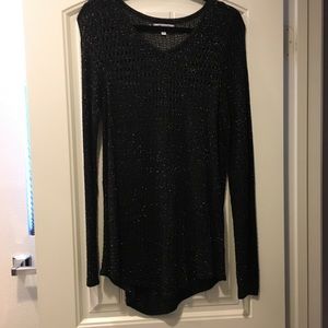 Jennifer Lopez black sweater with gold accent